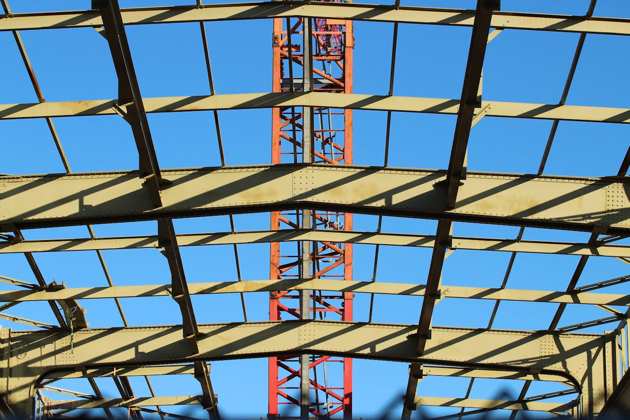 services-01 View of a steel construction framework under clear blue sky in the Netherlands.